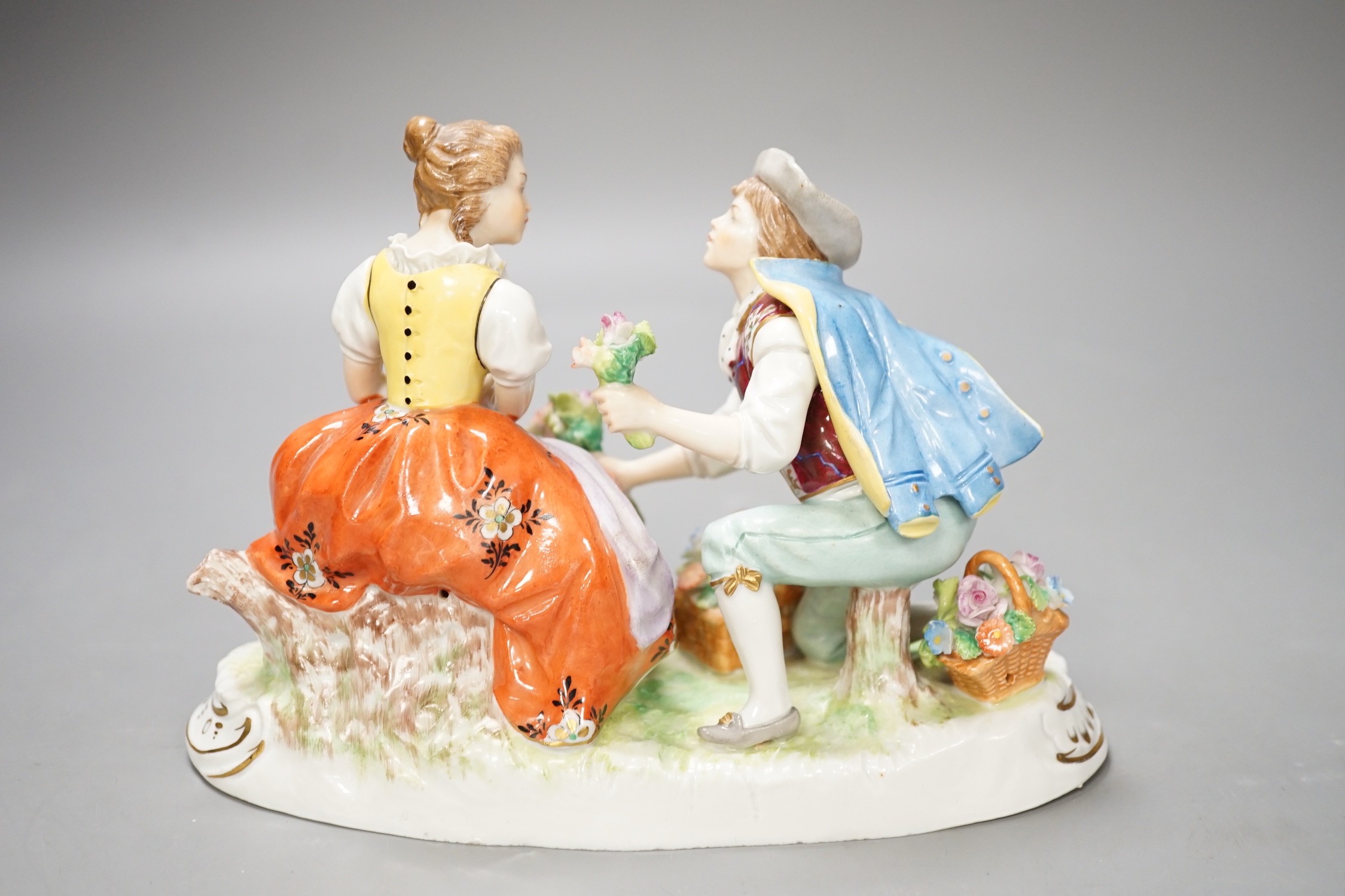 A Sitzendorf porcelain figure group of a romance. 13cm high